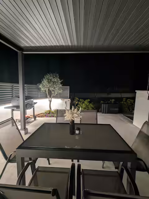 The Luxe Hideaway BBQ area at night